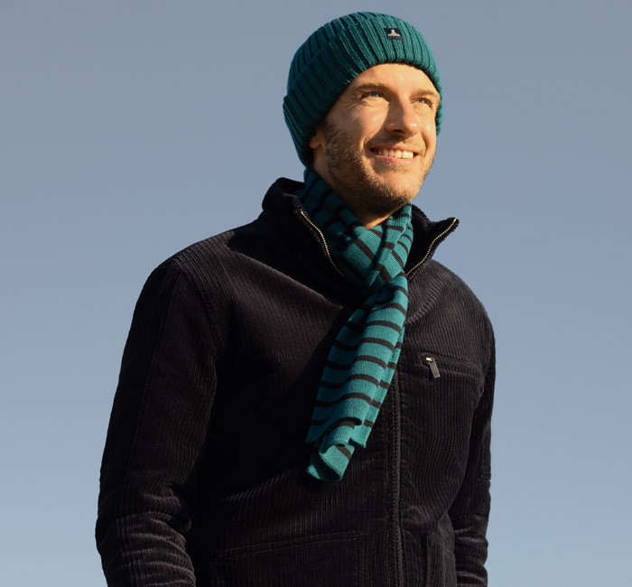 Man wearing a scarf and beanie