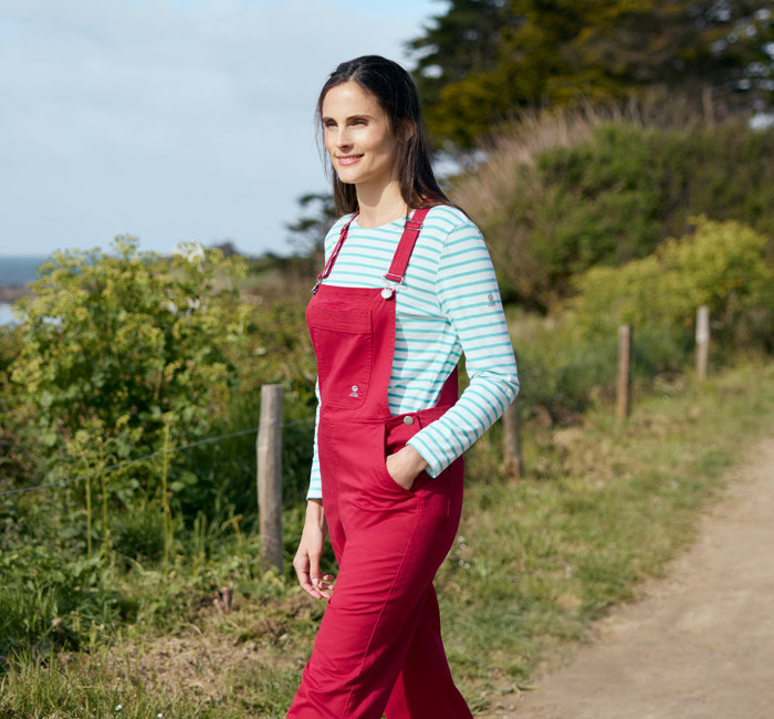 Woman wearing red overalls