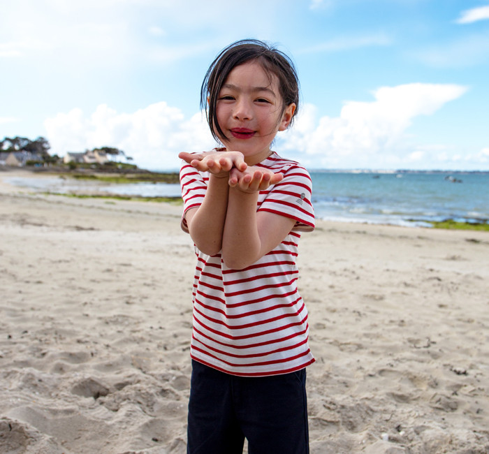 Child wearing a striped organic cotton t-shirt