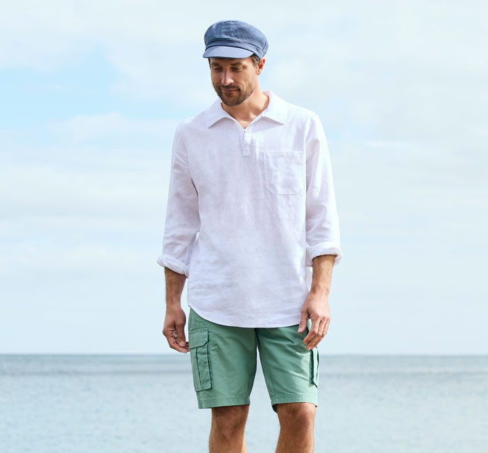 Man wearing yellow cotton canvas bermuda shorts